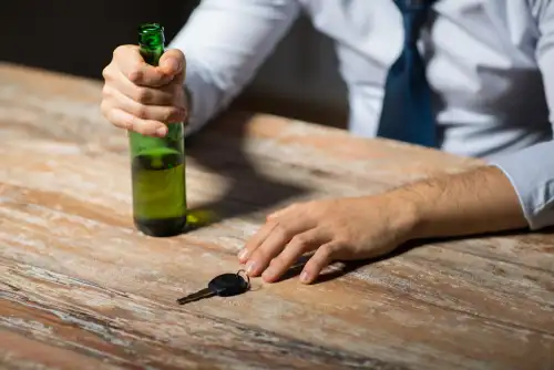 Man at bar with beer reaching for car keys