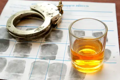 fingerprints, glass of liquor, and hand cuffs